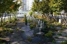 Urban garden with trees and small fountains