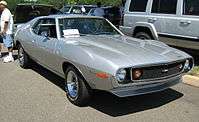 Shows a silver 1971 AMC Javelin AMX - the performance model with "flush" wire-mesh grille