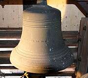 This is an image of the 6th Bell in the Highland Arts Theatre Chime, showing the inscription "STRENGTH AND BEAUTY ARE IN HIS SANCTUARY." from Psalm 96:6 - Honour and majesty are before him: strength and beauty are in his sanctuary. This bell rings a C♯ and weighs 650 lb (290 kg).