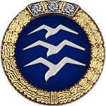 Badge: on a blue disc, silhouette of three white birds stacked in flight, the whole surrounded by a gold wreath surmounted with three diamonds