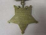 Closeup of star-shaped medal's back side