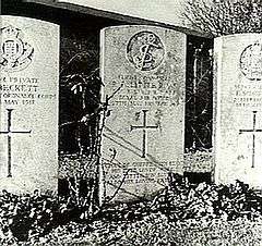 Three light-coloured grave stones, the centre one being dedicated to "R.A. Little"