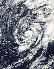 A cyclone with banding clouds wrapping cyclonically over its center