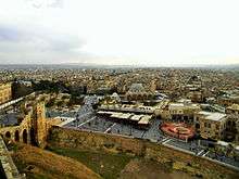 City view with a wall and a mosque.