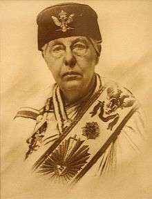 Photograph (sepia tint) of Annie Besant in masonic gown, hat and sash
