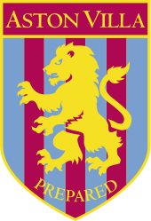 A badge with a yellow border and a yellow lion rampant facing to the left. The background is vertical claret and blue alternating stripes. At the bottom is the motto prepared written in yellow.