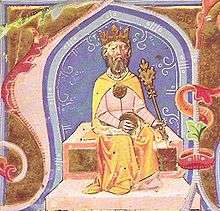 A bearded man sitting on a throne wearing a crown