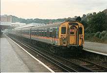 Photograph showing a 4CEP electric multiple unit at Hastings. The unit is in "Jaffa Cake" livery.