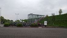 Glass entrance to station with bikes in front