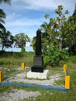 neddle monument on island