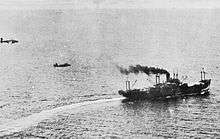 Two aircraft fly after a ship at very low altitude