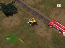 An industrial field with dirty grass and patches of dirt. A bulldozer is centered in the screenshot, traveling to the upper left towards railroad tracks and a bush. Nearby are lights along a road, both lit and unlit. Close behind is a red fire engine-like vehicle with two cylinders mounted atop, along its length. In the bottom left of the heads up display is a green radar circle showing obstacles in the upper left, and alongside the radar, a yellow arrow pointing to the upper left, indicating the location of the next structure in the red carrier truck's path. In the upper right of the heads up display is the number zero, preceded by a dollar sign, indicating that no damage to property has been scored.