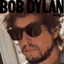 A photograph of Dylan's face, wearing sunglasses and a short beard