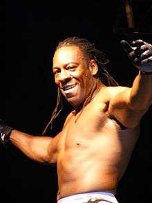 Booker T posing in a wrestling ring