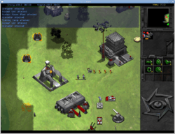 On the right is a small vertical panel witch icons and a small map. The remaining three quarters of the screen is a digital depiction of grass plain, with black and grey areas to represent unexplored regions. Three metallic looking buildings are placed on the plain, surrounded by military vehicles and personnel. Certain units have gauges above them, representing their state of damage.