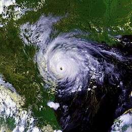 A mature hurricane with a well-defined, cloud free eye over southern Texas. The Gulf of Mexico can easily be seen to the right of the storm and Mexico to the left. Parts of the southern United States are also in the top of the image.