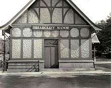 Side of the train station; sign reading "Briarcliff Manor"