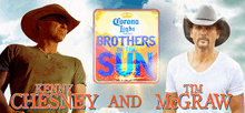 Two men stand on either side of the image, both in cowboy hats and necklaces. Kenny Chesney, the man on the left, has on a brown cowboy hat and a gold necklace. He is also wearing a faded green shirt with an indistinguishable logo on it. Tim Mcgraw, the man on the right, has on a white cowboy hat with a white shirt. He is also wearing a silver necklace tucked underneath this shirt. Behind them is the sky. Dividing them is the tour logo.