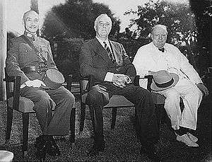 Three men, Chiang Kai-shek, Franklin D. Roosevelt and Winston Churchill, sitting together elbow to elbow