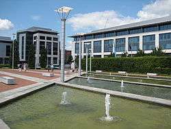Modern office block c.2000, with water feature in foreground