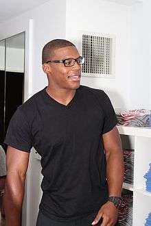 A picture of Cam Newton with glasses on.