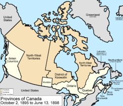 Map of the country of Canada on October 2, 1895, depicting the larger postage stamp sized province of Manitoba along with the provinces of Ontario, Prince Edward Island, Quebec (southern portion only), New Brunswick, British Columbia and Nova Scotia, in the colour white. The disputed area between Manitoba and Ontario is resolved, Ontario expands west to the Lake of the Woods and north to the Albany River. The Northwest Territories is separate from the District of Keewatin north, and territories are depicted in the colour pink; additionally now the northern arctic islands are a part of the NWT. The District of Keewatin now has a geographically shaped border to encompass the eastern borders of the newly formed provisional districts of the NWT. The area called Newfoundland, Labrador, and Alaska are depicted in bluish grey colour, and are not a part of Canada.
