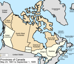 Map of the country of Canada on May 23, 1901, depicting the larger postage stamp sized province of Manitoba along with the provinces of Ontario, Prince Edward Island, Quebec, New Brunswick, British Columbia and Nova Scotia, in the colour white. The disputed area between Manitoba and Ontario is resolved, Ontario expands west to the Lake of the Woods and north to the Albany River. The North-West Territories is separate from the District of Keewatin north of Manitoba. Territories are depicted in the colour pink; the northern arctic islands are a part of the NWT. The District of Keewatin now has a geographically shaped border to encompass the eastern borders of the newly formed provisional districts of the NWT. Yukon Territory is now formed from the NWT, and is expanded. The area called Newfoundland, Labrador, and Alaska are depicted in bluish grey colour, and are not a part of Canada.