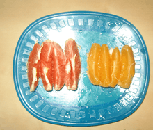 Slices of common and cara cara oranges on a plate