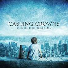 A boy is sitting on a ledge overlooking a cityscape, a megaphone positioned on his left-hand side. The name of the album is positioned above his head, with the logo of the band stationed above that; both the album title and band name are written in capital letter, while the 'T' in 'Casting Crowns' is replaced by a cross.