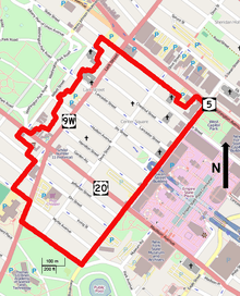 A map of the district with its boundary outlined in red, showing highway designations and points of interest