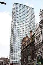 A tower block surrounded by shorter buildings