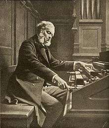 drawing of a grey-haired man with side whiskers playing a pipe organ