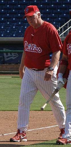 Charlie Manuel walks down the baseline with an unidentified Phillies player