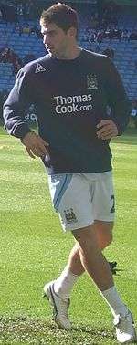 Ched Evans warming up before a match for Manchester City