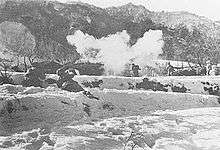 Soldiers charging into thick smoke