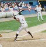 Jim Thome batting left-handed in a game in 1993; he is amidst his stride forward, and is about to swing.