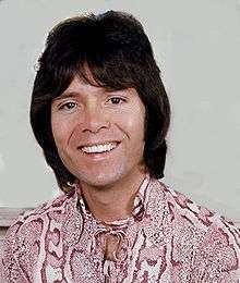 Head-and-shoulders colour photograph of Cliff Richard in 1975.