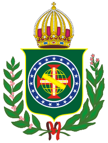 Coat of arms consisting of a shield with a green field with a golden armillary sphere over the red and white Cross of the Order of Christ, surrounded by a blue band with 19 silver stars; the bearers are two arms of a wreath, with a coffee branch on the left and a flowering tobacco branch on the right; and above the shield is an arched golden and jeweled crown
