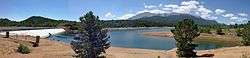 A photo of Crystal Creek Reservoir with Pikes Peak in the background in August
