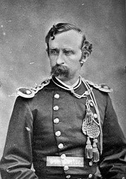 Black and White photo of Col. Custer with mustache and uniform taken in 1875.