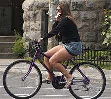 Woman riding a bicycleupright=0.9