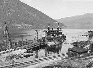 Historic photo of the ferry preparing to cross Lake Tinn.