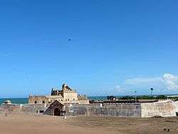 A view of Dansborg Fort with Bay of Bengal in the background