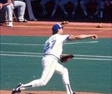 An image of Dave Stieb, in a Toronto Blue Jays uniform and viewed from the side/rear, pitching in 1985