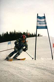 man skiing near ski gate