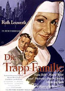 Poster showing a nun smiling and a couple embracing