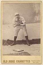  Doc Bushong on an 1888 Old Judge baseball card, showing glove.