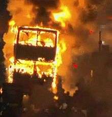 A double-decker bus burning on Tottenham High Road during the 2011 England riots
