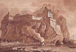 Dumbarton castle in 1800 and functioning lime kiln with smoke in the foreground.