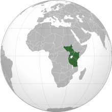 An orthographic projection of the world, highlighting the East African Community's Member States (green).